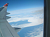 Cause and Effect? Jet exhaust and mile upon mile of melting ice.  A photograph taken over the Atlantic in April 2004